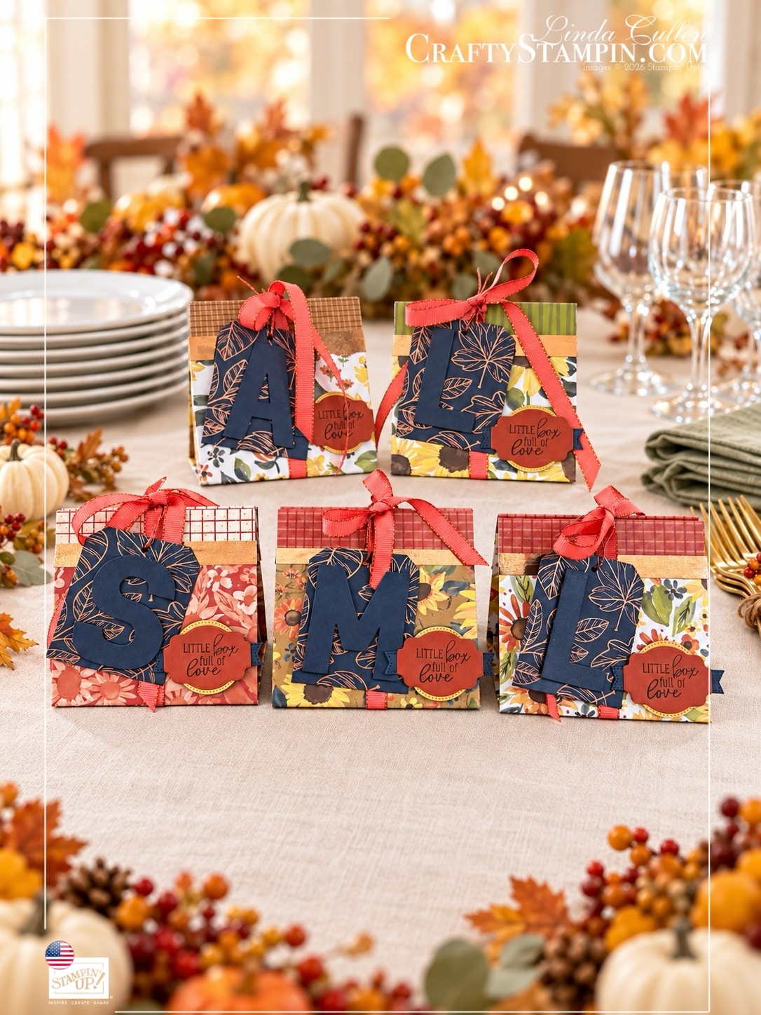 Five boxes with stacked plates and napkins Five Thanksgiving mini tea boxes with personalized monogram tags, autumn papers, and coral ribbon beside stacked plates and sage napkins.