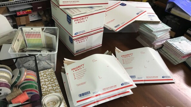 Packing up Round 1 of the Product Shares in Priority mailing boxes and envelopes.